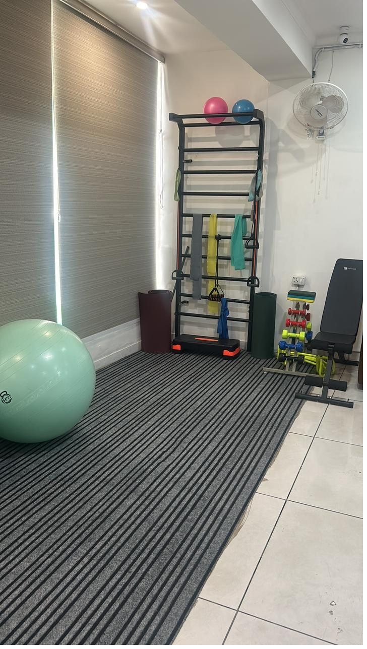 Encore therapy bay with exercise equipment and wall bars